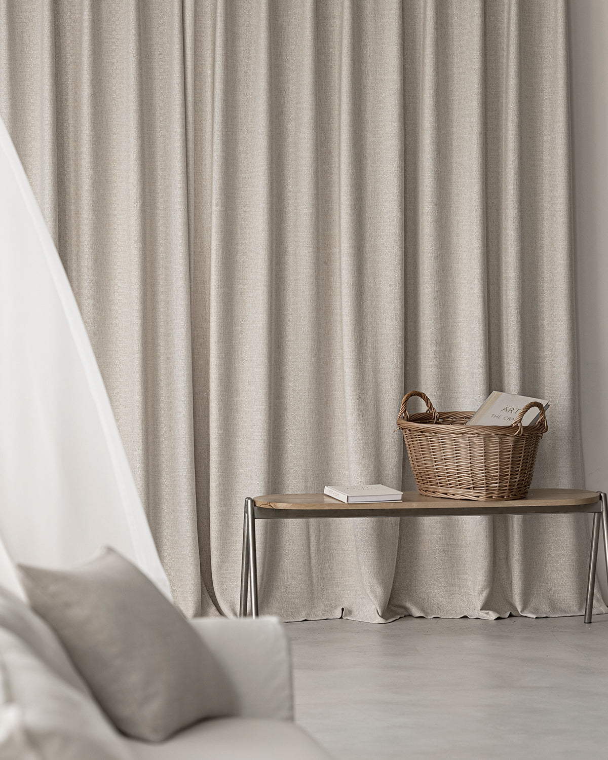 A close-up of the bottom hem of the Alma drape, showing its natural linen texture.