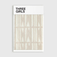 A fabric swatch for the Celia curtain, showcasing its raised jacquard weave in a symmetrical, triangular Roman pattern