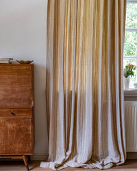 A close-up of the Thea striped curtain's woven texture, made from 100% recycled fiber.