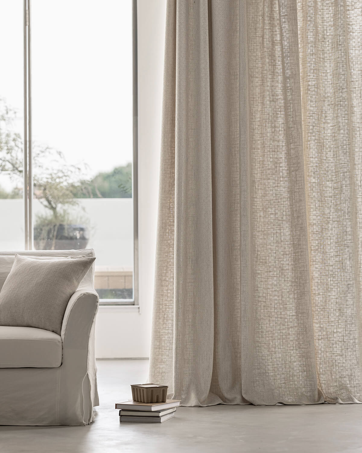 The Alma natural texture drapes creating a light and airy feel in a modern room.