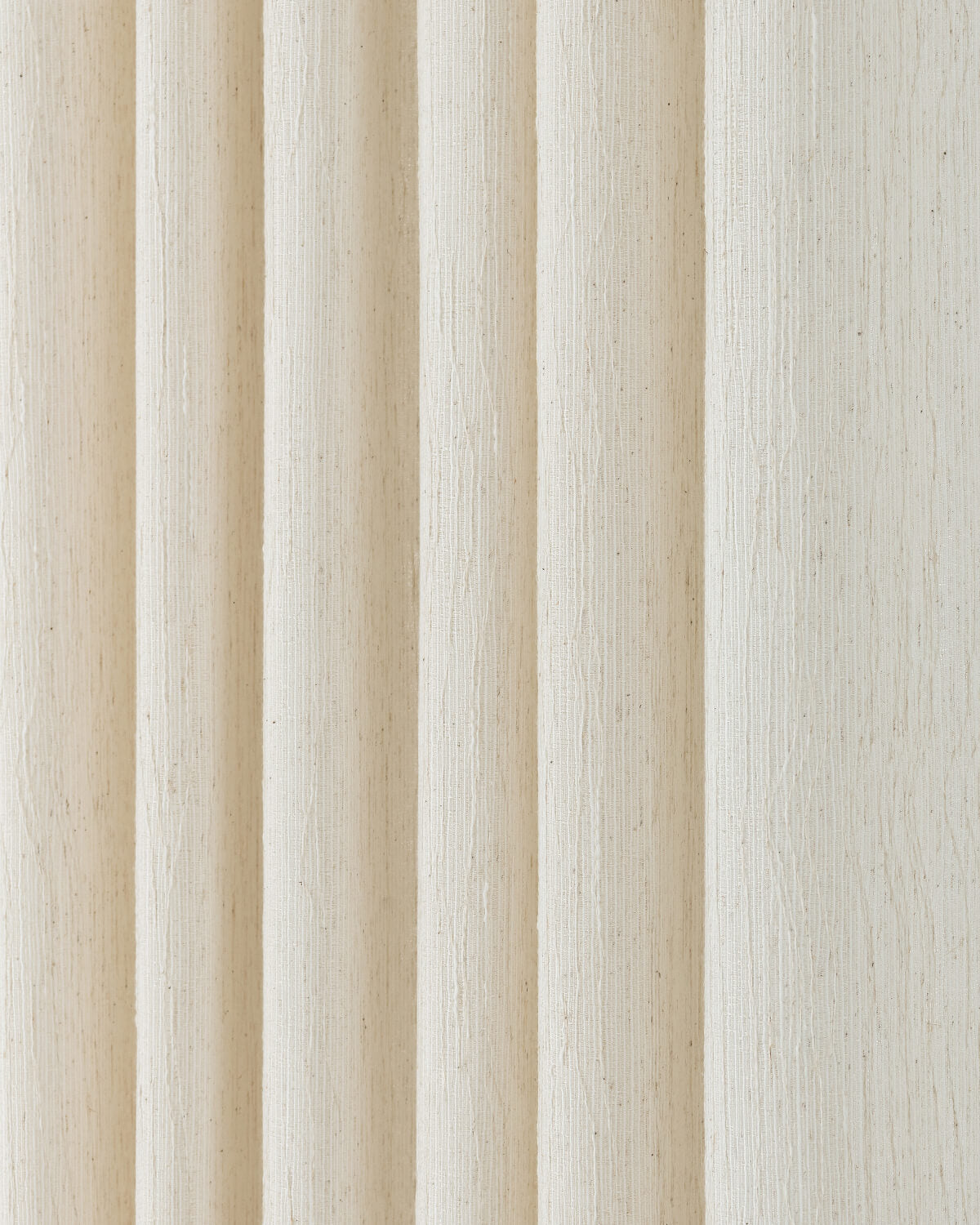 A close-up of the June sheer curtain fabric, showing its 3D vertical striped texture.