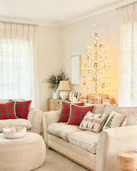Liz light-filtering linen curtains serving as an elegant backdrop for a festive Christmas tree in a living room.