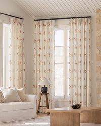 Bella hand-painted camellia pinch pleated floral curtains in a bright living room