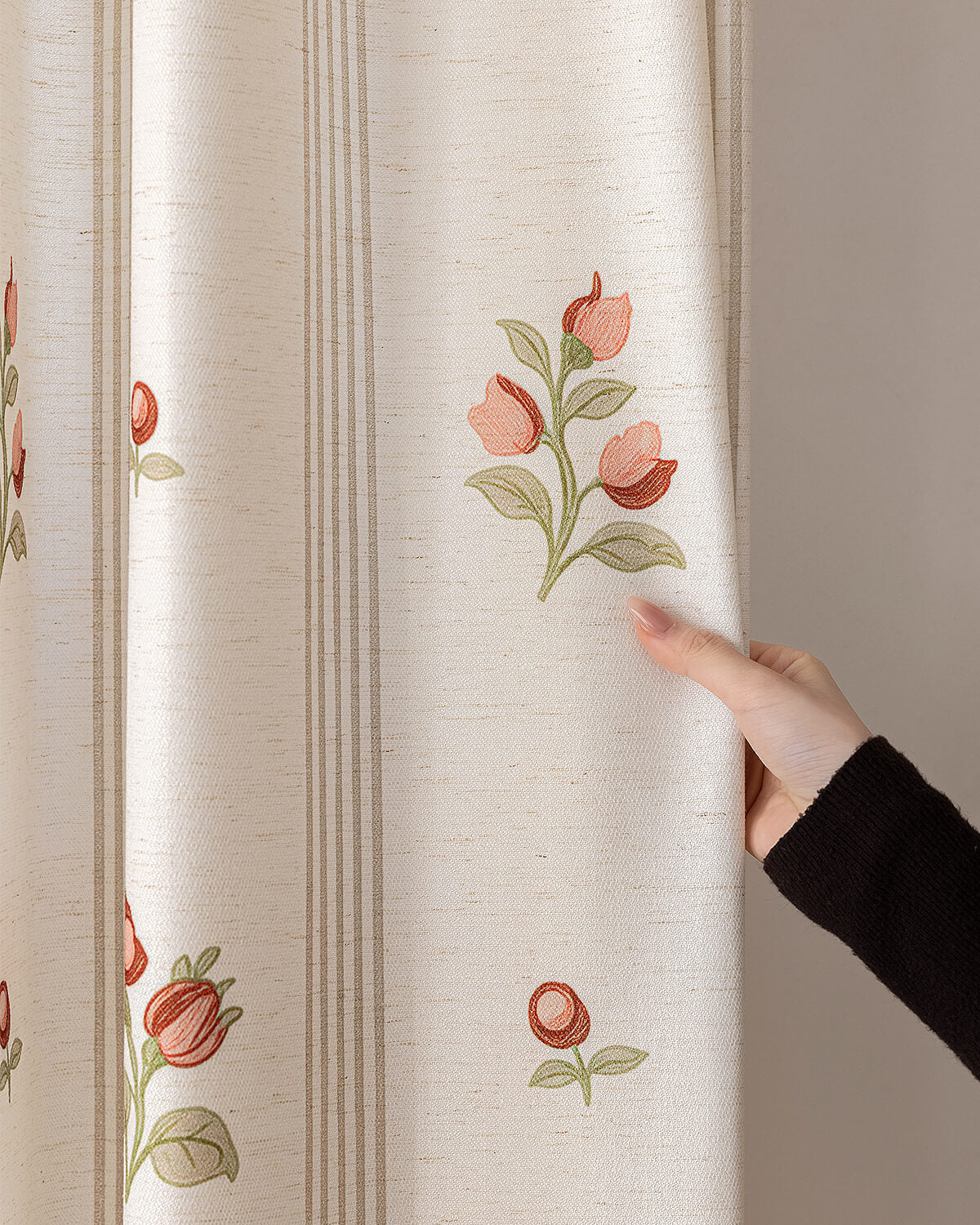 A hand touching the premium 366gsm floral linen curtains for living room