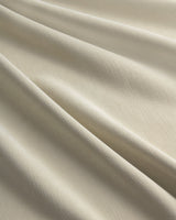 A close-up of the soft, textured fabric of the Chenille blackout curtain in Fuzz beige.