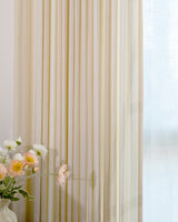 Close-up of beige pinstripe cotton blend curtains showing lightweight texture and 50 percent light blocking.