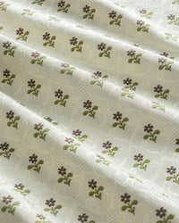 Close-up of the intricate ditsy floral pattern on 350 gsm thick recycled fiber curtains for a sustainable home.