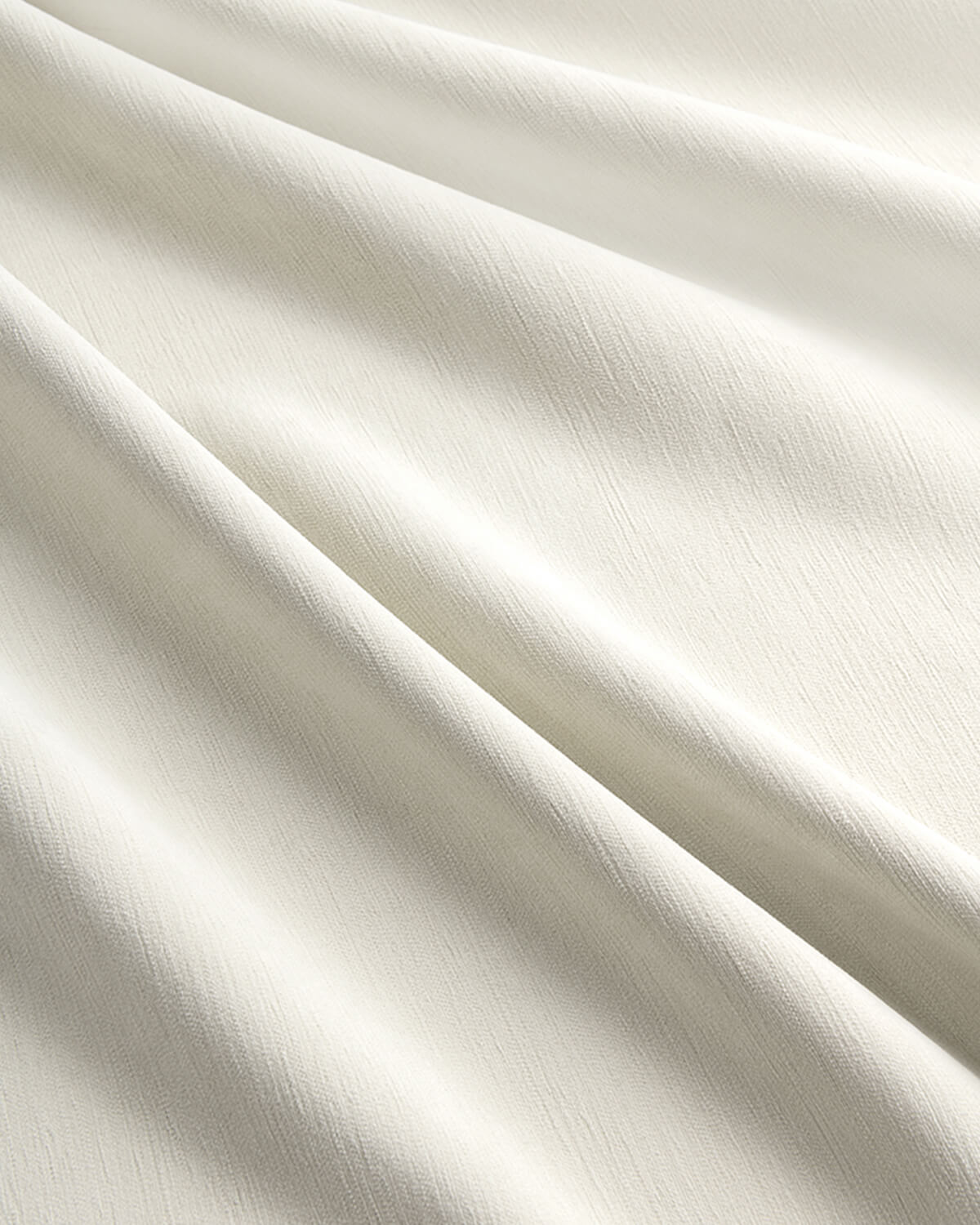 Detailed shot of the tailored pinch pleat header on a Kely Chenille curtain panel.