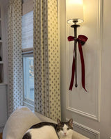 Light filtering patterned drapes offering a decorative and textured alternative to standard plain solid curtains.