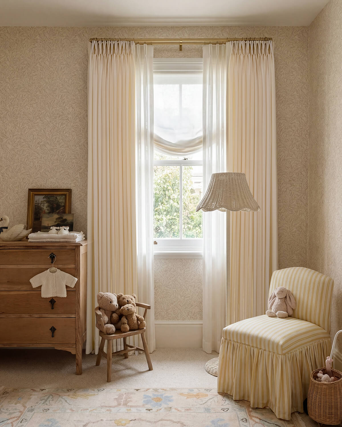 Darcy beige cotton blend curtains with pinstripe pattern in a cozy room featuring a yellow striped armchair.
