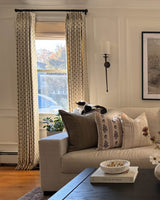 Long curtains with a delicate floral motif styled in a luxury puddle length for traditional drapery trends 2026.