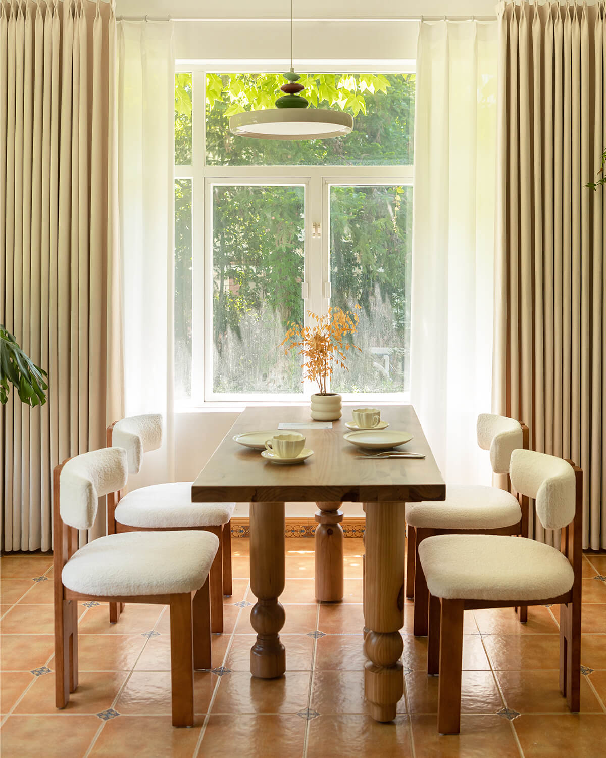Mell beige Chenille blackout curtains framing a dining room window with a garden view.