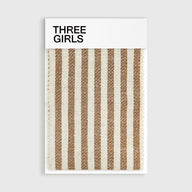 A fabric swatch for the Colette striped curtain in warm brown and cream, showing its woven linen-blend texture