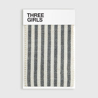 A fabric swatch for the Colette striped curtain in black and cream, showing its woven linen-blend texture