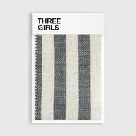 A fabric swatch for the Colette striped curtain in black and cream, showing its woven linen-blend texture
