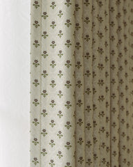 A detailed close-up of the jacquard weave and ditsy floral pattern on the Aurelia curtain.