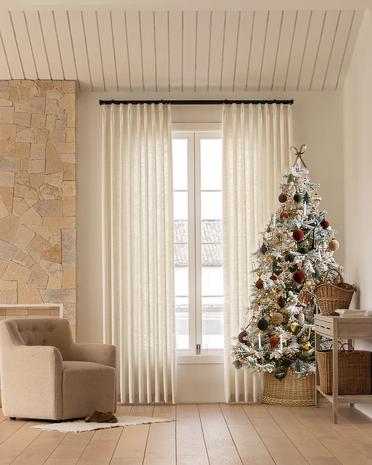 Zen linen textured light-filtering curtains framing a tall double window in a festive living room with a Christmas tree.